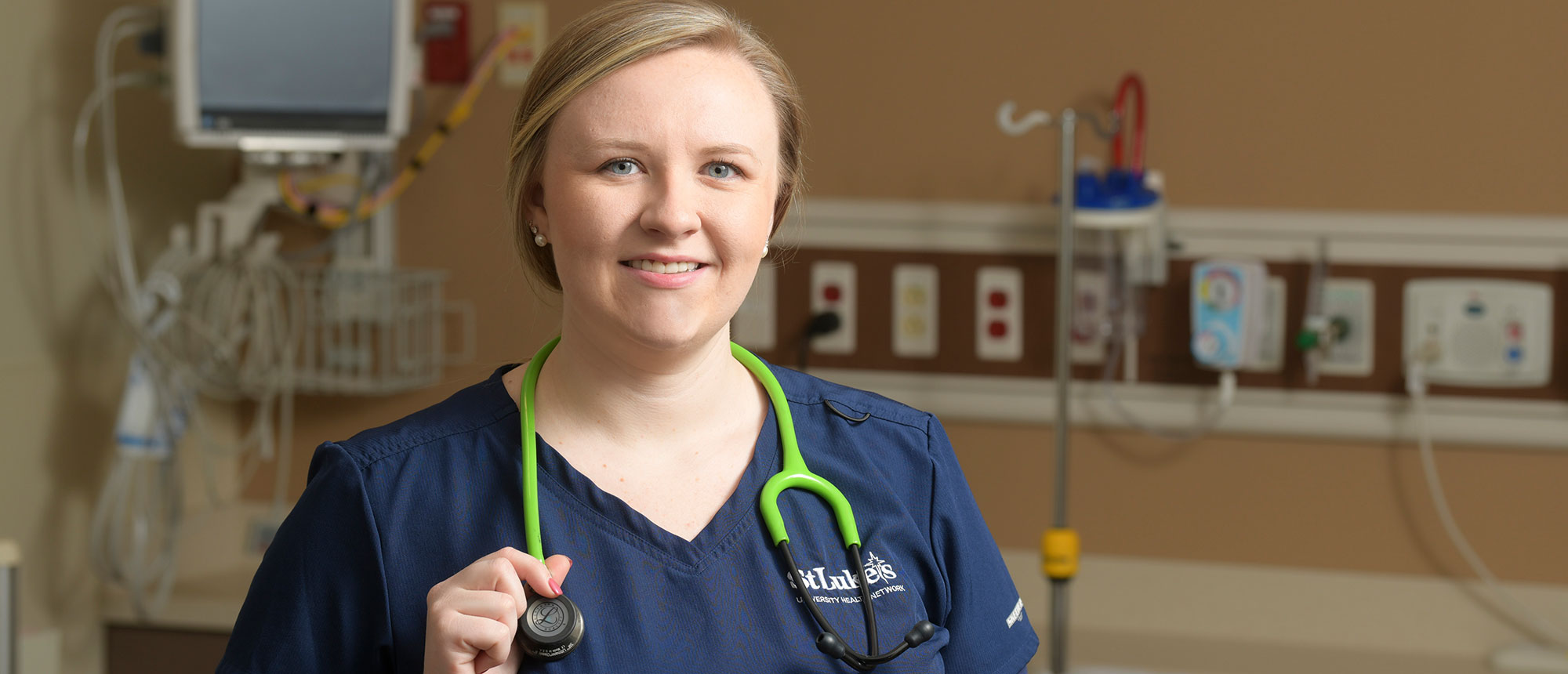 Students working in campus library computer room